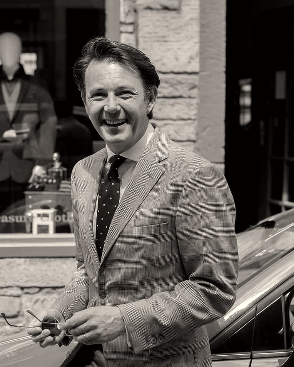 Craig Banks, photographed outside his shop in Edinburgh wearing his own glen check suit